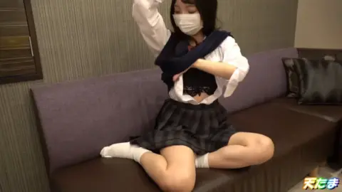 Asian Schoolgirls in Face Masks on Couch
