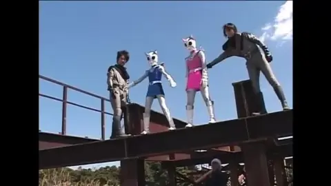 Asian Teens in Costumes and Protective Gear Outdoors