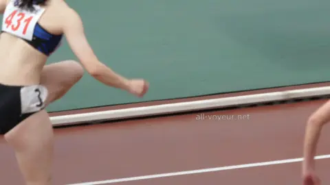 Asian Athletes Running Track