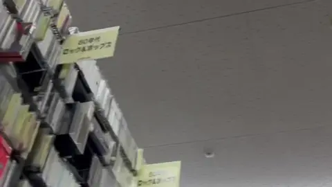 Asian Girl in Music Store