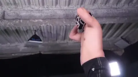 Asian Woman in White Bikini Embraces Muscular Man