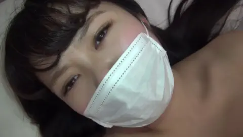 Asian Couple Intimate Moments in Bedroom