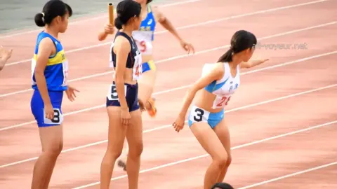 Women Running on Track