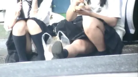 Asian Schoolgirls in Uniform Flirt on Street