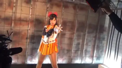 Asian Girl in Costume with Tentacle Prop