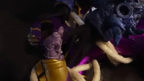 Asian Girl in Purple and Gold Costume Bondage and Tentacles