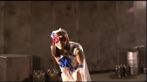 Asian Schoolgirl in Sailor Fuku and Red Mask