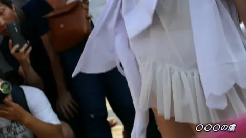 Asian Woman in White Dress Exposing Legs Outdoors