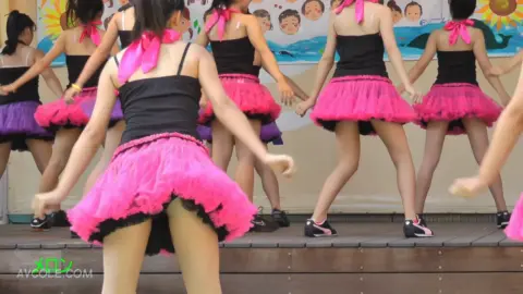 Asian Teens Dancing on Stage