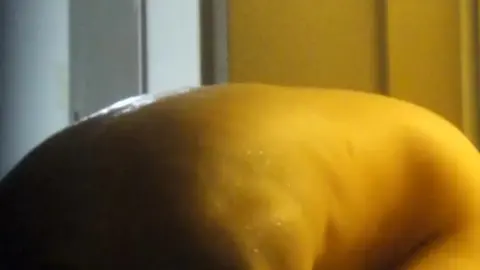 Slim Brunette Drying Off After Shower