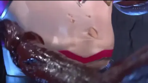 Asian Superheroine Fights Dark Creature