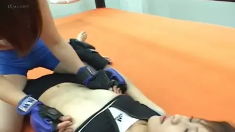 Asian Lesbians Wrestling in Martial Arts Ring