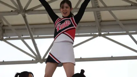 Asian Teen Cheerleaders Indoor Performance