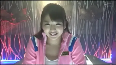 Asian Teen in Pink Outfit Performs