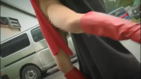 Asian Duo in Cape and Mask Encounter