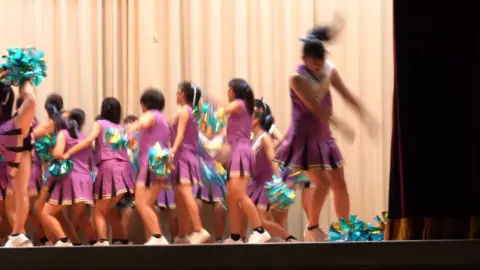 Asian Cheerleaders Dance in Uniforms