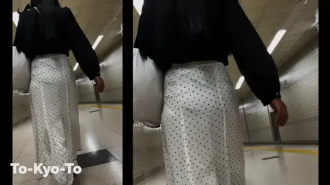 Asian teen in white skirt with black dots