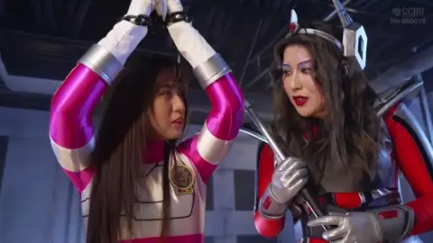 Asian Girls in Costumes Embrace and Restraint