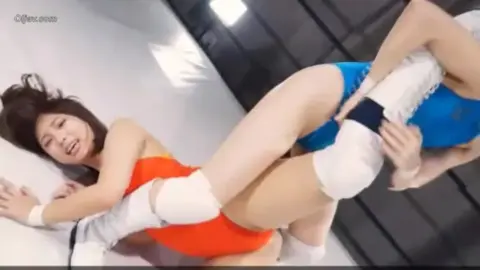 Asian Lesbians Wrestling in Ring