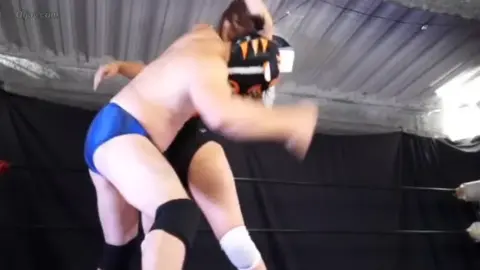 Asian Wrestlers in Intense Matches