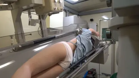 Brunette in MRI Machine