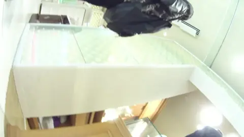 Blonde in Black Pantyhose and Orange Dress