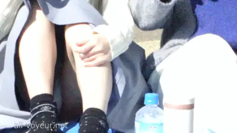 Asian Couple Enjoying Ice Cream in Park