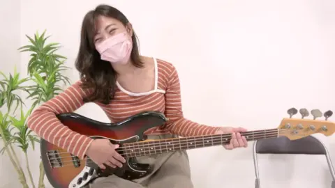 Asian Girl Plays Bass Guitar