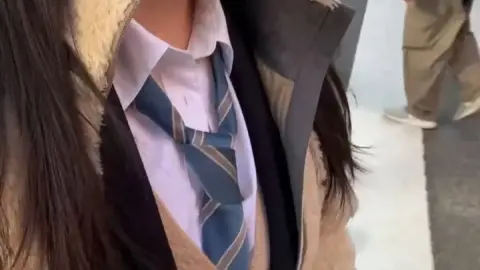 Asian Woman in Stockings on Train