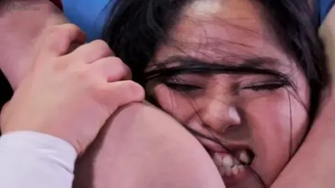 Asian Women Wrestling in Ring