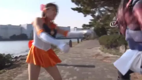 Asian Schoolgirls in Fantasy Costumes Fighting