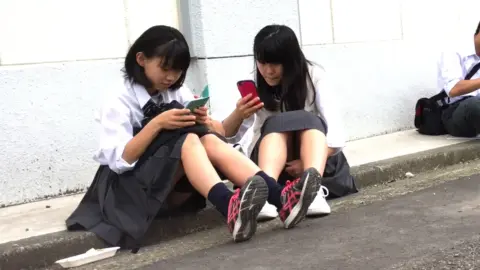 Asian Teens in School Uniforms Outdoor