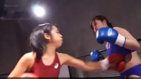 Asian Girls Boxing Match in Gym