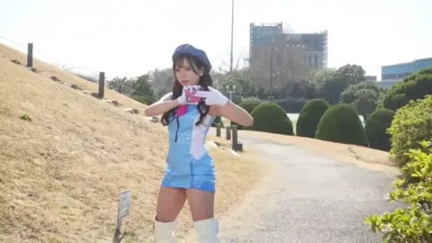 Asian Cosplay Duo in Fantasy Outfits Outdoor