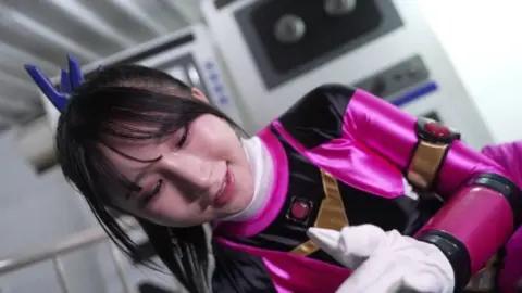 Asian Lesbians in Futuristic Costumes