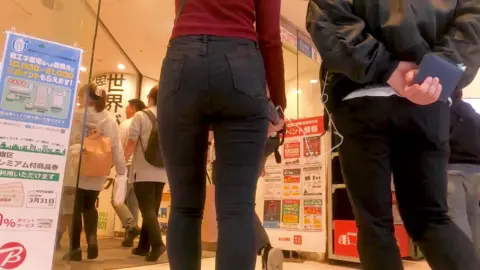 Asian Girl in City Street and Clothing Store