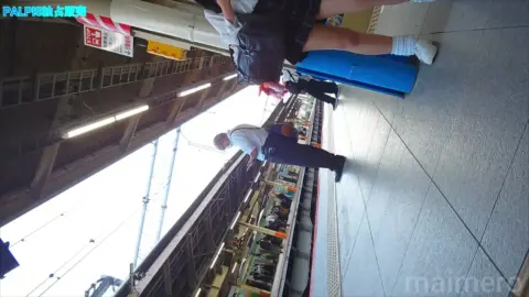 Asian Girl in Skirt on Train