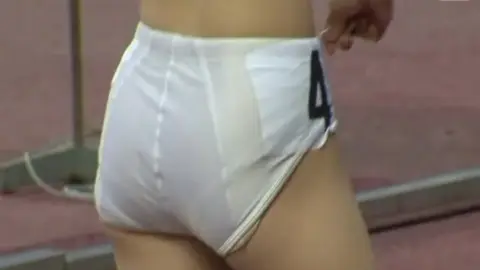 Asian Athletic Beauty in Track Stadium