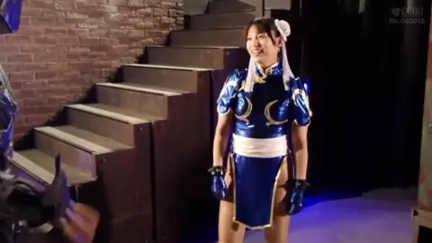 Asian Girls in Blue and Gold Costume Scene