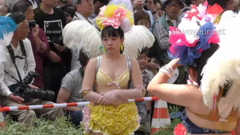 Asian Girls in Bikinis and Feathered Headdresses