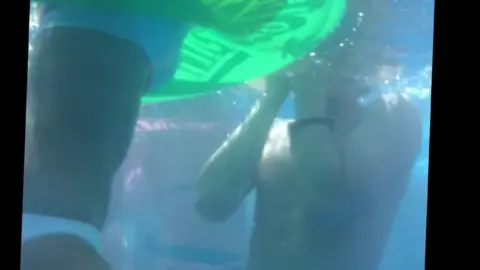 Underwater Intimacy in Red and Blue Swimsuits