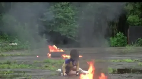 Asian Woman in Bodysuit in Abandoned Industrial Area