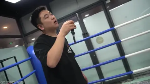 Asian Couple Engages in BDSM Role-Play