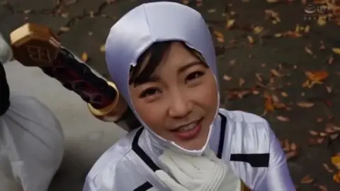 Asian Women in Costume Play with Swords