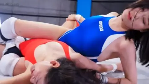 Asian Women Wrestling in Ring