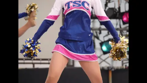 Asian Teens Cheerleader Dance with Pom-Poms