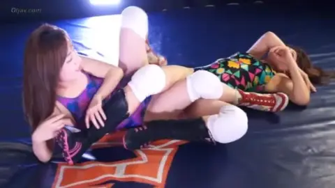 Asian Lesbians Wrestling in Ring