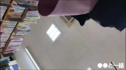 Asian Teen in Pink Skirt Browsing in Store