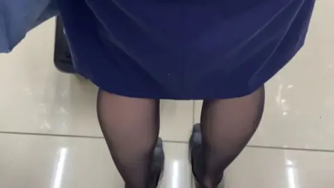 Asian Women in Blue Uniforms