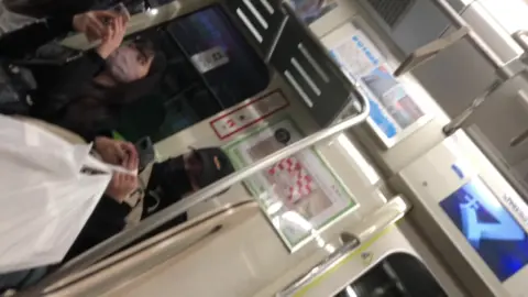 Asian Girls in Face Masks on Train